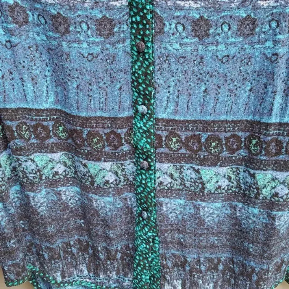 BKE Black Blue Green Top with a cut out in the back size Medium